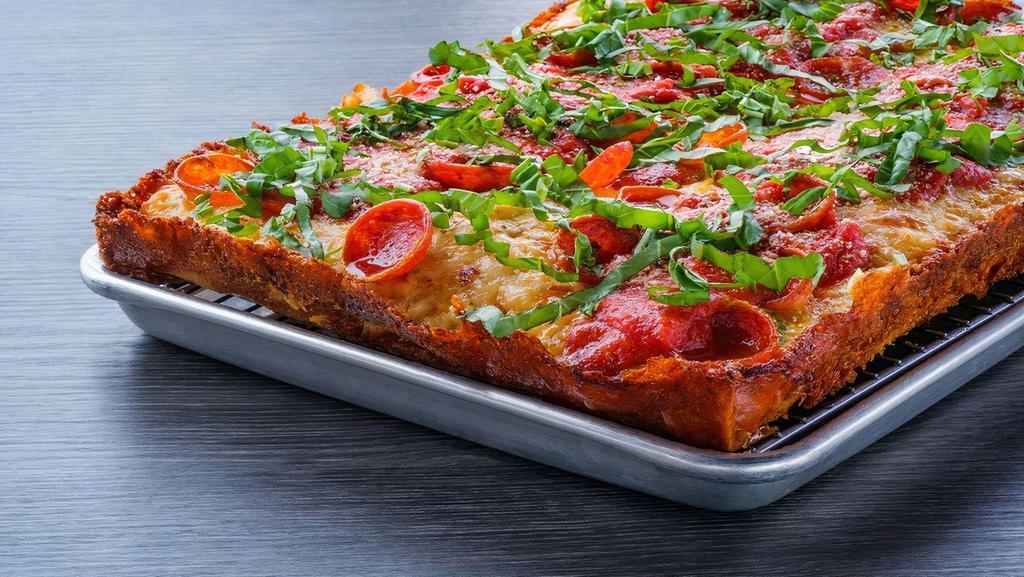 Rosa - Detroit Style · Detroit style pizza with white cheddar, brick cheese, mozzarella, thick and thin.