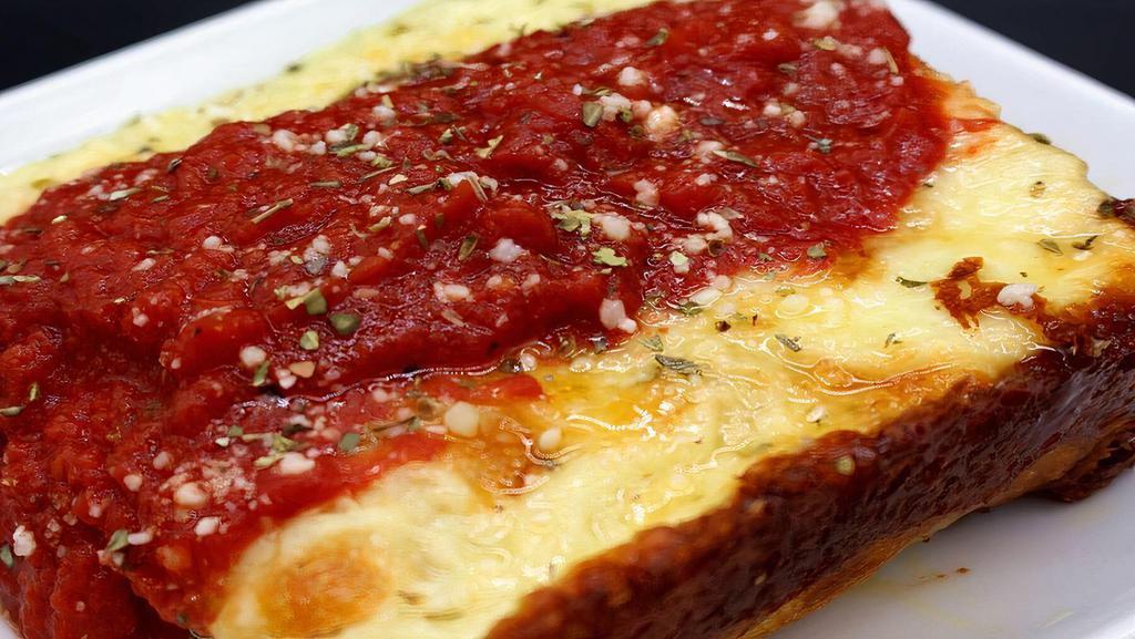 Red Top - Detroit Style · Detroit style pizza with white cheddar, brick cheese, mozzarella.