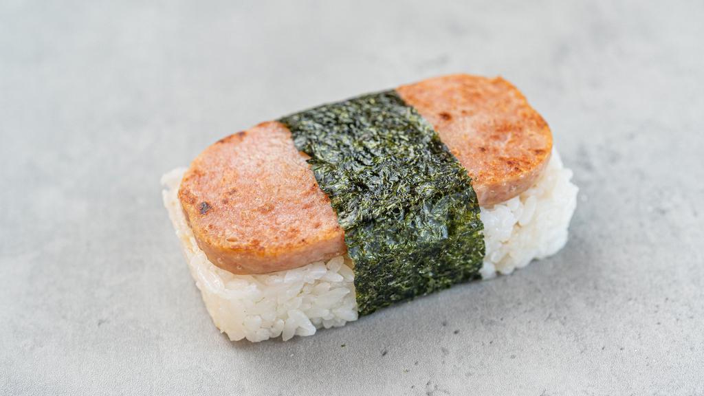 Spam Musubi · Steamed rice cake with baked spam on top, sold by the piece.