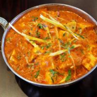 Karahi Paneer · Paneer cooked with onions, bell peppers and tomatoes.