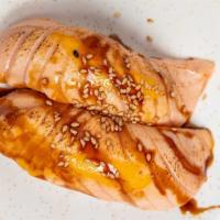 Seared Salmon · Raw. Salmon seared outside, raw inside, spicy mayo, eel sauce on top.