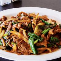 Mongolian · Spicy. (Chicken, Beef or Shrimp) Wok fried with scallions and onions. Served in a spicy garl...