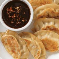 Potstickers (6) · Pan fried chicken dumplings served with our signature chili soy sauce.
