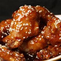 Sesame Chicken Wings (6) · Fried chicken wings served in our signature sweet sesame sauce top with toasted sesame seeds.