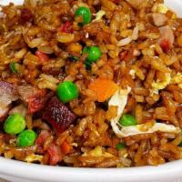 Fried Rice · Wok fried with scrambled egg. scallions, onions, peas, carrots and soy sauce.