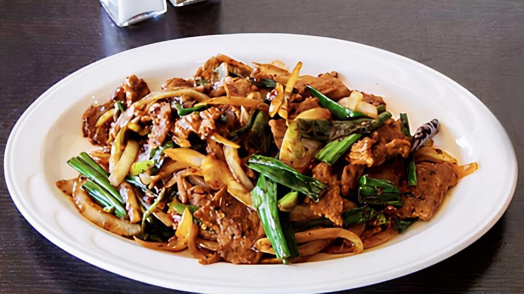 Mongolian · Spicy.  Chicken,  beef, or shrimp.  Wok fried with scallions and onions served in a spicy garlic soy sauce