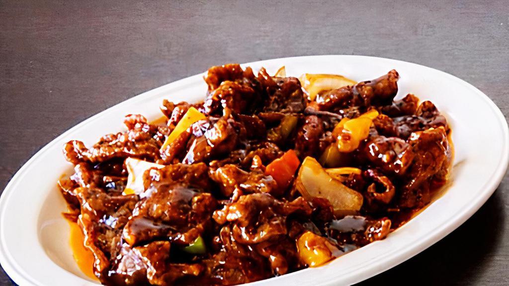Pineapple Beef · Spicy. Wok seared with lightly battered slices beef, pineapple, onions and bell pepper in a chili pineapple sauce.