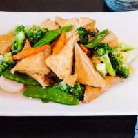 Tofu W. Mixed Vegetables · Light fried tofu with assorted vegetables in a clear garlic wine sauce.