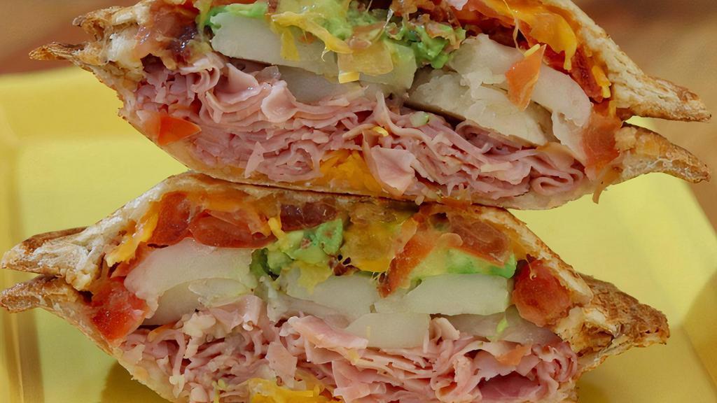 No 26* · Thinly sliced ham, crisp bacon, fresh tomatoes and avocados, scalloped potatoes, and shredded cheddar cheese, Zookz creamy picante buttermilk sauce