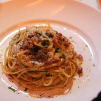Spaghetti Carbonara · Pancetta, Prosciutto, Bacon, Onions, Cream Sauce.