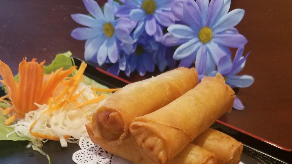 Egg Rolls · Four rolls. Vegetables, glass noodles, wrapped with rice paper, deep fried and served with sweet and sour sauce.