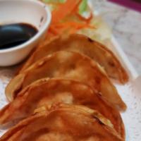 Pot Sticker · Six pieces. Chicken dumpling deep fried and served with soy sauce.