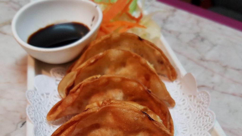 Pot Sticker · Six pieces. Chicken dumpling deep fried and served with soy sauce.