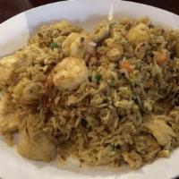 Pineapple Fried Rice · Chicken,Shrimp carrots, raisins, peas, eggs and cashew nuts.