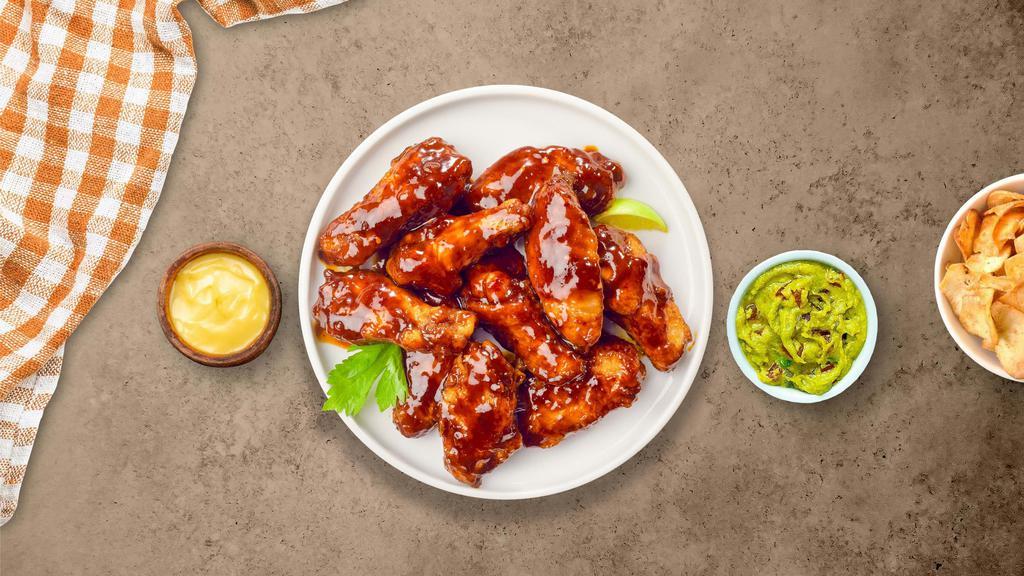 Bbq Bliss Wings · Breaded or naked fresh chicken wings, fried until golden brown, and tossed in barbecue sauce. Served with a side of ranch or bleu cheese.