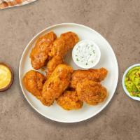 Holy Habanero Wings · Breaded or naked fresh chicken wings, fried until golden brown, and tossed in mango habanero...