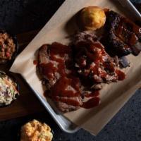 Trifecta · Pulled pork, brisket, and St. Louis ribs. Includes baked beans, cornbread plus two (2) addit...