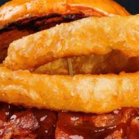 Western Burger · Angus burger topped with BBQ sauce, crispy bacon, Cheddar cheese, and onion rings.