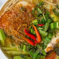 Canh Chua/Sour Soup · Sour soup with catfish, okra, bean sprouts, tomato, and taro.