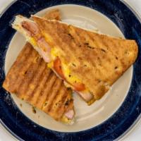 Ham And Cheese Panini · Honey ham with honey mustard, tomatoes & cheddar cheese grilled on seasoned focaccia bread.