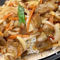 Mongolian Beef · Sliced tender beef, onions, carrots, hot pepper spicy sauce ganished on top of saifon noodles.