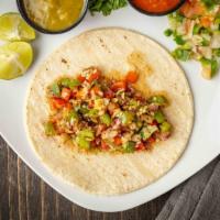 Veggie Taco · Red and green bell pepper cabbage onions soy sauce on corn tortillas