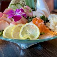 Sashimi Deluxe · Raw. 18 pieces assorted sashimi. Served with house salad and miso soup.