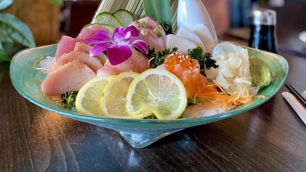 Sashimi Deluxe · Raw. 18 pieces assorted sashimi. Served with house salad and miso soup.