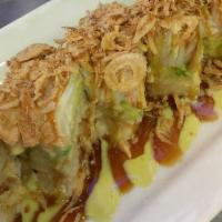 Asian Tiger Roll · Soft shell crab inside. Topped with avocado, kani, and crispy onion. Wasabi mayo and eel sau...