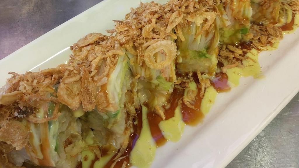 Asian Tiger Roll · Soft shell crab inside. Topped with avocado, kani, and crispy onion. Wasabi mayo and eel sauce.