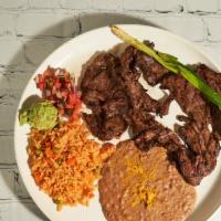 Carne Asada (8 Oz) · The authentic thin, tender steak grilled to perfection served with green onion, pico de gall...