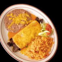 Enchiladas La Costa · Carne asada enchiladas topped with your choice of red or green sauce and melted cheese.