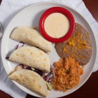 Fish Tacos (3) · Flour tortillas with grilled fish garnished with cabbage, pico de gallo, and creamy house sa...