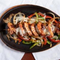 Camarones Costa Azul · Shrimp wrapped in bacon, topped with melted jack cheese - fajita style.