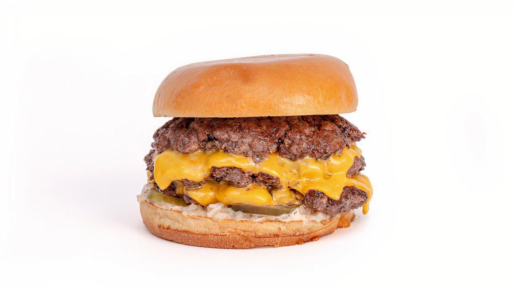 The Triple Burger · Smashed triple patties, American cheese on a squishy bun.