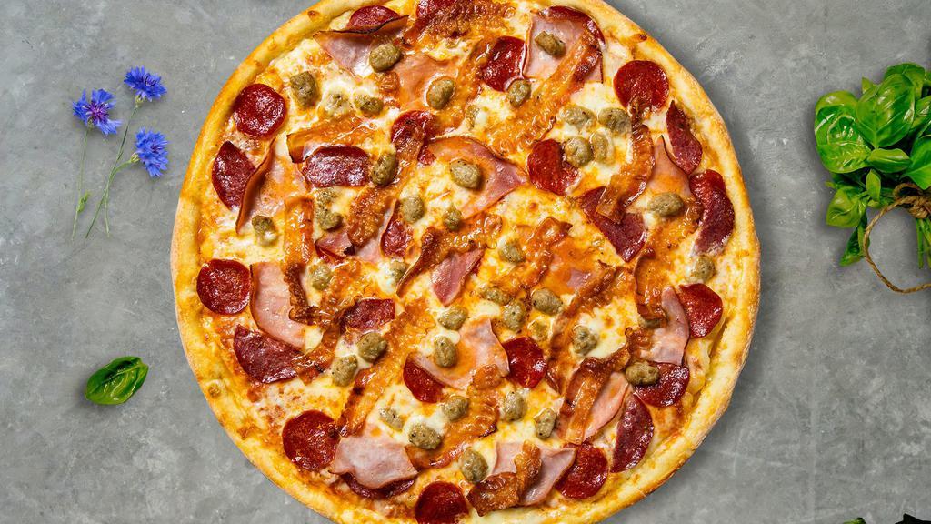 Meat Magnet Pizza  · Mozzarella, pepperoni, chicken, and sausage baked on a hand-tossed dough