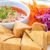 Fried Tofu · Deep-fried tofu served with sweet and sour sauce top with crushed peanuts.