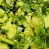 Cucumber Salad 凉拌黄瓜 · With garlic, cilantro and vinegar sauce.