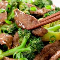Beef Broccoli 芥蓝牛 · Tender beef strips with broccoli, carrots and onion stir fried in a brown sauce.