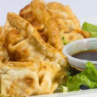 Gyozas (5) · Crunchy pork dumplings served with a side of citrus soy dipping sauce.