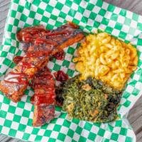 Bbq Favorite Plate · Pulled pork or ribs served with mac-n-cheese and Greens.