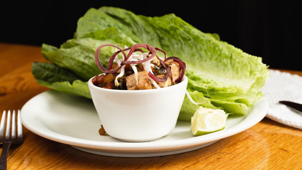 Asian Lettuce Wraps · Can be made gluten free. Tempeh, diced vegetables, garlic, ginger, chiles, tamari, romaine leaves.