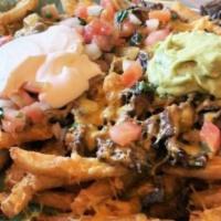 Carne Asada Fries
 · French fries topped with melted cheese and delicious carne asada with guacamole, sour cream,...