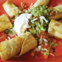 Taquitos Rancheros
 · 4 deep-fried corn taquitos shredded beef or chicken, cut in half and served with guacamole  ...