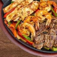 Chicken Fajitas
 · Marinated chicken sautéed with bell pepper and onions. Served with rice, beans, guacamole, s...