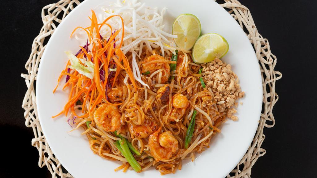 Pad Thai · Stir fried thin rice noodles with egg, onions, bean sprouts & peanuts.