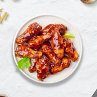 Honey Hell Wings · Breaded or naked fresh chicken wings, fried until golden brown, and tossed in honey & hot sa...