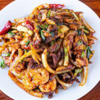 3 Flavor Mongolian · Spicy. Shrimp, chicken and beef with onions cook in spicy hot sauce and garnished with rice ...