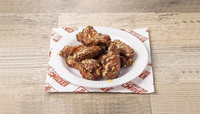 Traditional Wings - 8 Piece · Our wings come in our choice of bone-in or boneless and your choice of sauce. Available in 8 or 16 pieces.  Eat them alone or pair them with a side and a dipper.