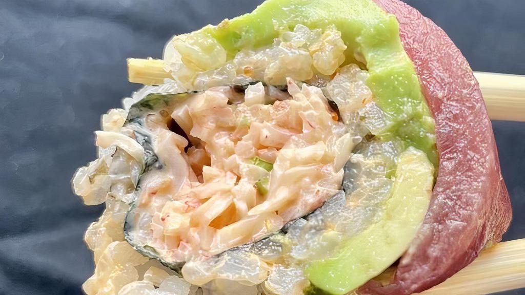 Manhattan Roll · Spicy crabmeat inside, topped with tuna, salmon and avocado.